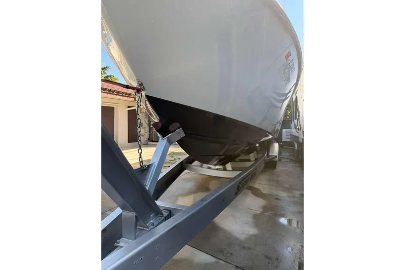  Yacht Photos Pics 2022 Contender 35 ST boat on trailer, parked in driveway.