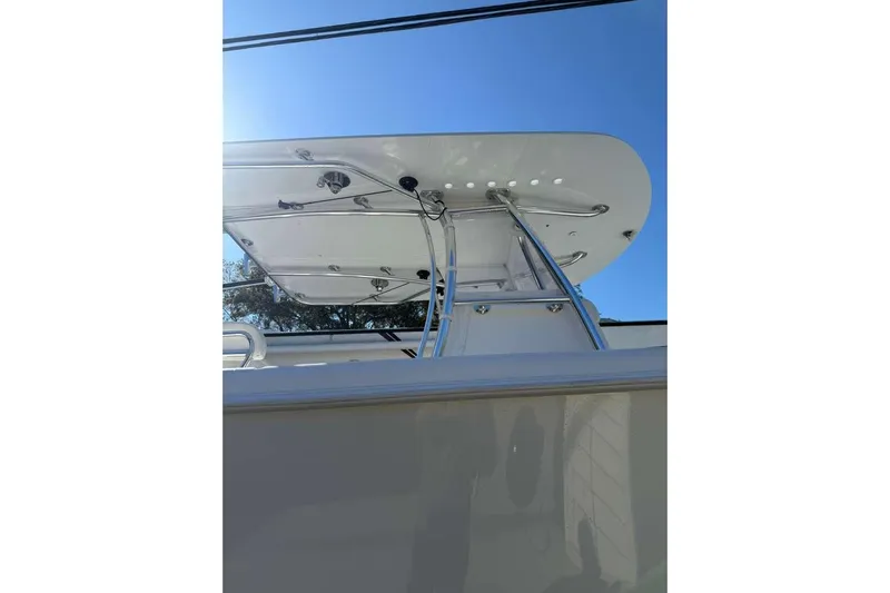  Yacht Photos Pics 2022 Contender 35 ST boat with sleek T-top design against clear blue sky.