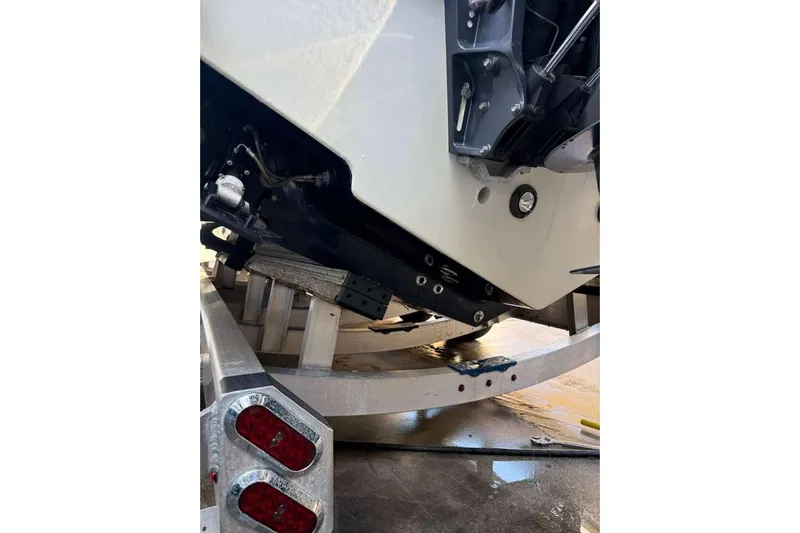  Yacht Photos Pics 2022 Contender 35 ST boat on trailer, rear view showing engine and hull details.