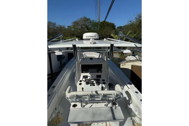  Yacht Photos Pics 2022 Contender 35 ST boat cockpit with Garmin equipment, sleek design, and modern controls.