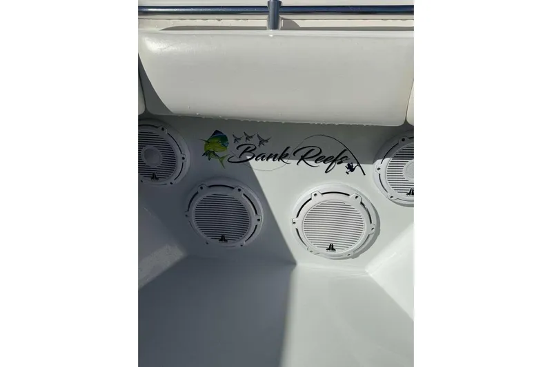  Yacht Photos Pics 2022 Contender 35 ST boat interior with "Bank Reef" logo and speaker system.