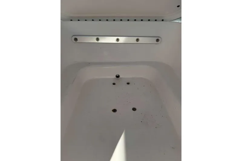  Yacht Photos Pics Contender 35 ST 2022 boat storage compartment with drainage holes.