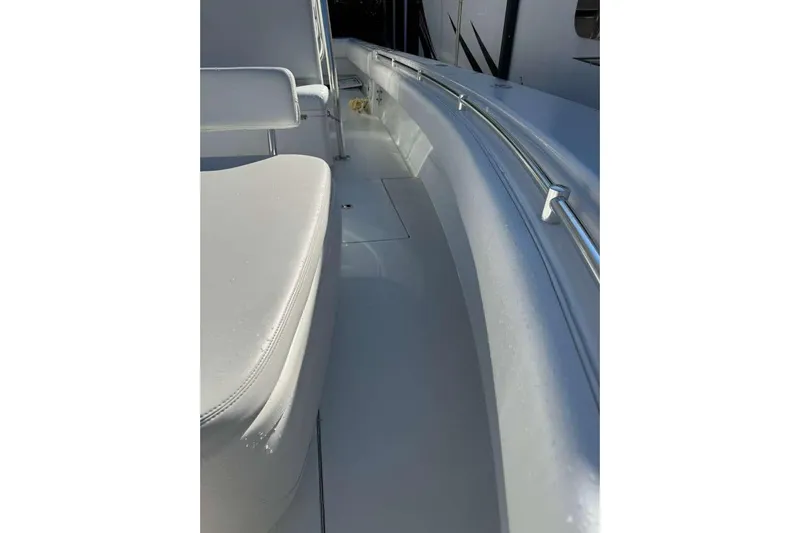  Yacht Photos Pics 2022 Contender 35 ST boat interior with sleek seating and polished railings.