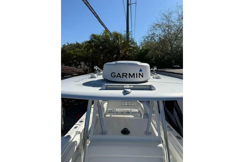  Yacht Photos Pics 2022 Contender 35 ST boat with Garmin radar, clear sky background.