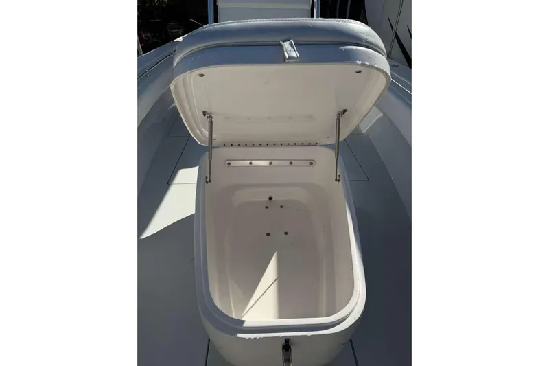  Yacht Photos Pics Open storage compartment on 2022 Contender 35 ST boat, showcasing interior space.