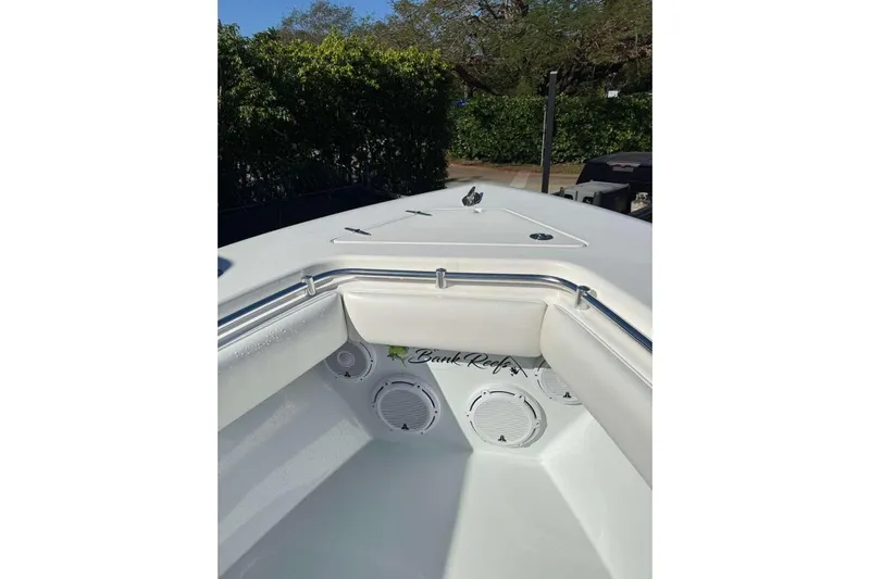  Yacht Photos Pics 2022 Contender 35 ST boat interior with speakers and cushioned seating.