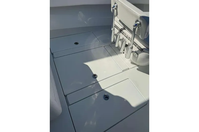  Yacht Photos Pics 2022 Contender 35 ST boat deck with storage compartments and rod holders.