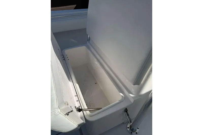  Yacht Photos Pics Open storage compartment on 2022 Contender 35 ST boat, showcasing interior space.