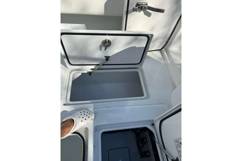  Yacht Photos Pics Open storage compartments on a 2022 Contender 35 ST boat deck.