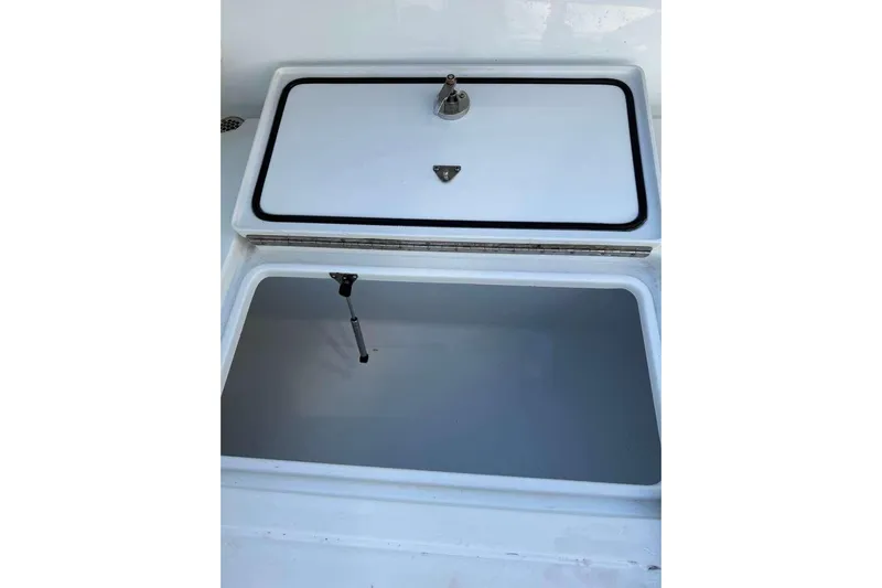  Yacht Photos Pics Open storage compartment on a 2022 Contender 35 ST boat.