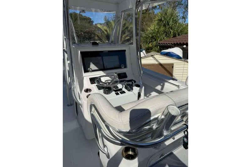  Yacht Photos Pics 2022 Contender 35 ST boat cockpit with modern controls and dual screens.
