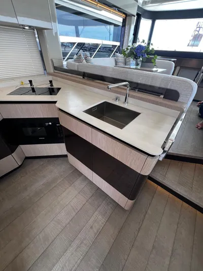  Yacht Photos Pics Modern kitchen area on 2025 Absolute NAVETTA 48 yacht with sleek design and elegant finishes.