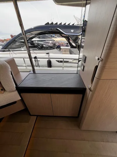  Yacht Photos Pics Interior view of 2025 Absolute NAVETTA 48 yacht, featuring sleek cabinetry and modern design.