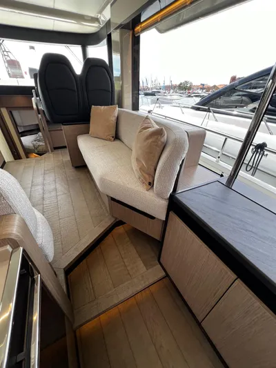  Yacht Photos Pics Luxurious interior of 2025 Absolute NAVETTA 48 yacht with modern seating and elegant design.