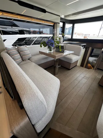  Yacht Photos Pics Luxurious interior of 2025 Absolute NAVETTA 48 yacht with elegant seating and modern decor.