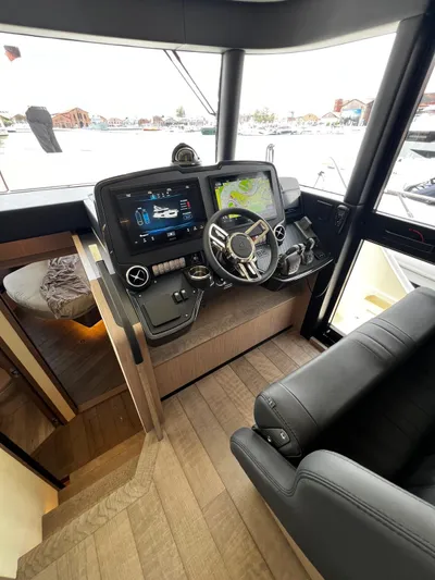  Yacht Photos Pics 2025 Absolute NAVETTA 48 yacht helm with advanced navigation systems and luxurious interior.