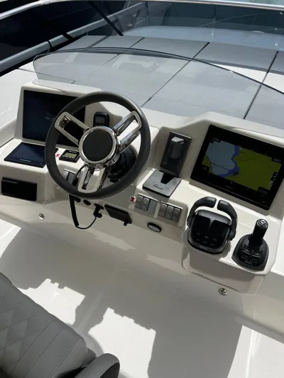  Yacht Photos Pics Helm of 2025 Absolute NAVETTA 48 yacht with modern navigation controls and displays.