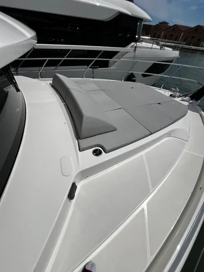  Yacht Photos Pics 2025 Absolute NAVETTA 48 yacht with sleek design and spacious sunbathing area.