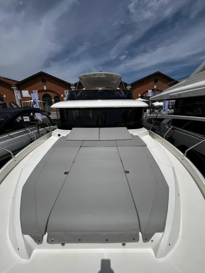  Yacht Photos Pics 2025 Absolute NAVETTA 48 yacht with sleek design, docked under a partly cloudy sky.