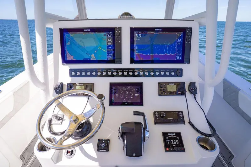 Showgirl Yacht Photos Pics 2023 Reef Runner 340 Center Console dashboard with navigation screens and controls.