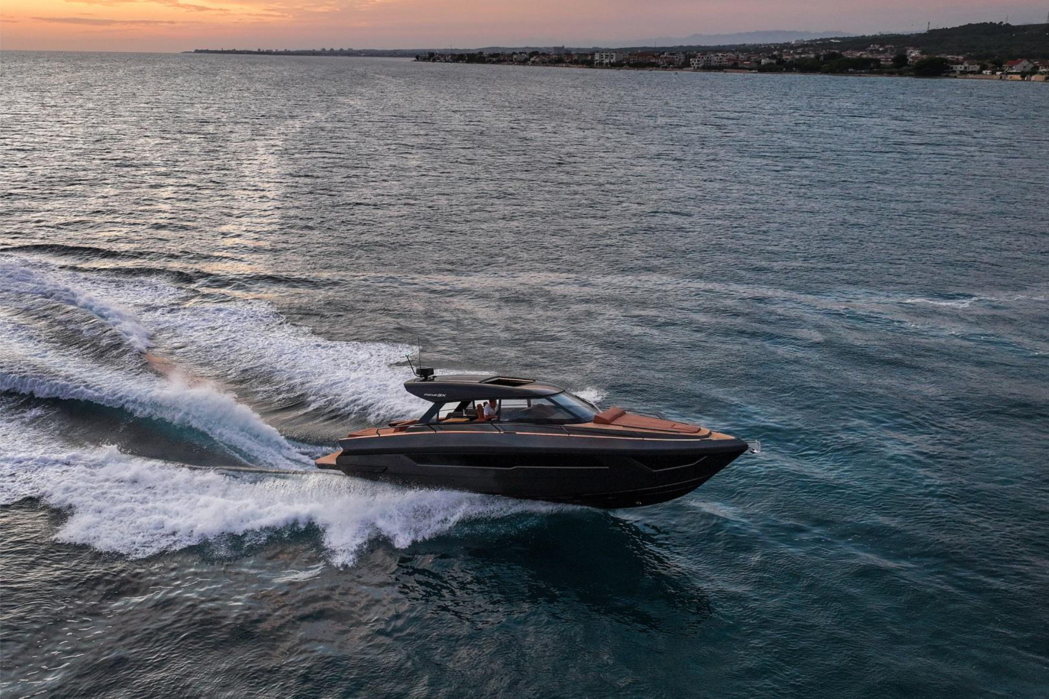 Luxury Focus 3X yacht cruising at sunset, 2025 model, on open sea.