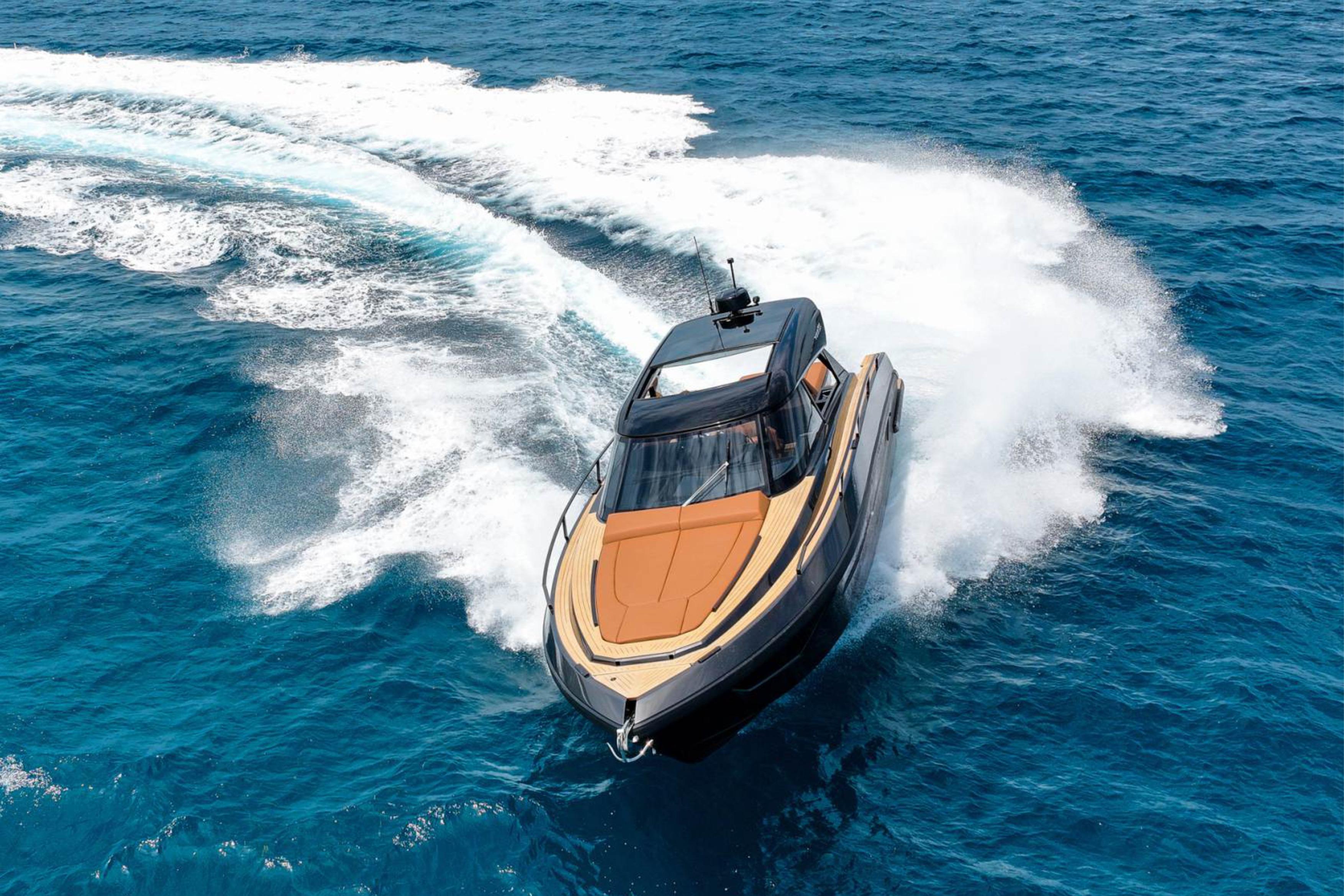 Luxurious 2025 Focus 3X yacht cruising swiftly on vibrant blue ocean waters.