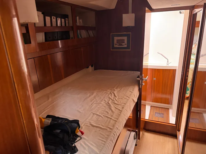Marina Yacht Photos Pics Cozy cabin interior of 2012 Amel 55 yacht with bed and wooden furnishings.