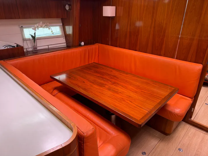Marina Yacht Photos Pics Luxurious Amel 55 yacht interior with orange seating and wooden table, 2012 model.