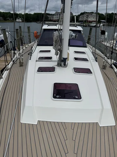 Marina Yacht Photos Pics Amel 55 sailboat, 2012 model, docked with sleek deck design and modern features.
