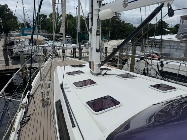 Marina Yacht Photos Pics Sailboat Amel 55, 2012 model, docked at marina with visible deck and hatches.