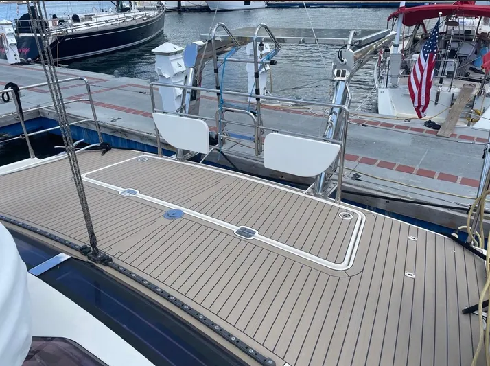 Marina Yacht Photos Pics Deck of 2012 Amel 55 yacht docked at marina with American flag.