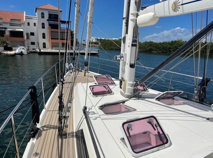 Marina Yacht Photos Pics Sailing yacht Amel 55, 2012 model, docked near waterfront buildings.