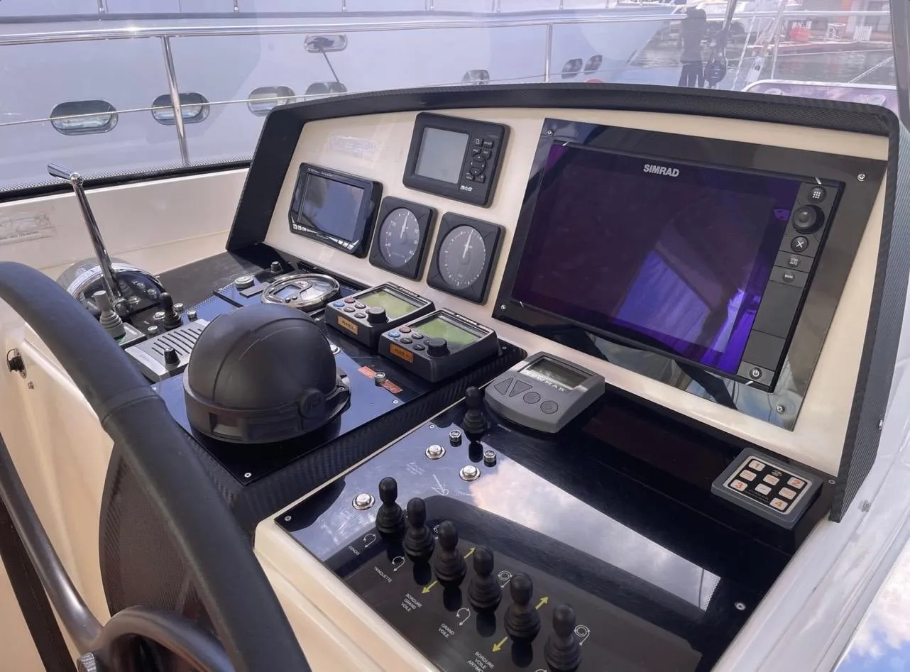 Control panel of a 2012 Amel 55 yacht with navigation instruments and displays.