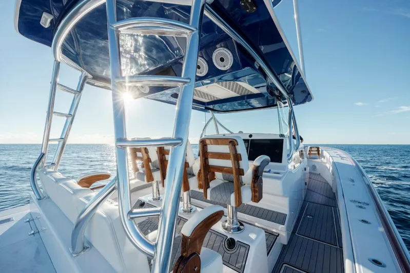  Yacht Photos Pics 2023 Front Runner 47 boat with sleek design, ocean view, and modern seating.