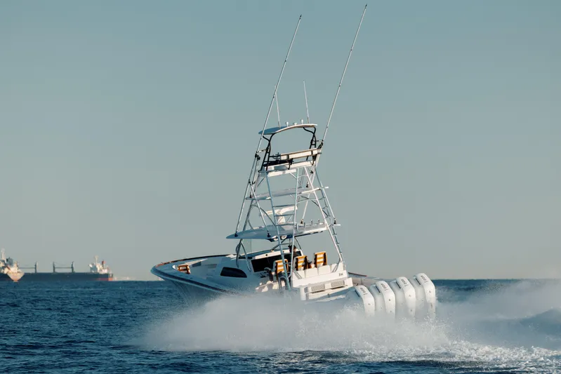  Yacht Photos Pics 2023 Front Runner 47 boat speeding on open water with multiple engines.