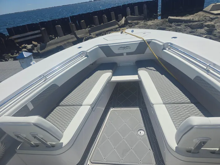  Yacht Photos Pics 2024 Invincible 43 Open Fisherman boat interior with cushioned seating and ocean view.