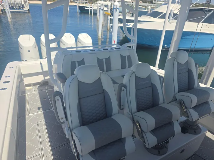  Yacht Photos Pics 2024 Invincible 43 Open Fisherman boat interior with luxurious seating and modern design.