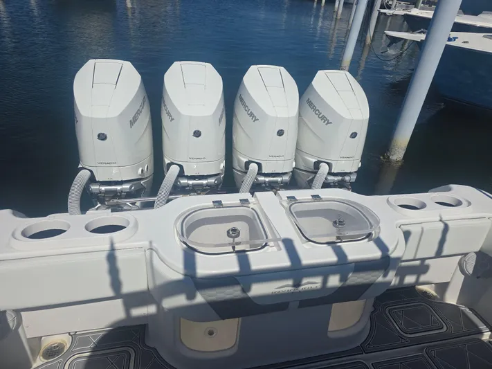  Yacht Photos Pics 2024 Invincible 43 Open Fisherman with four Mercury outboard engines at dock.