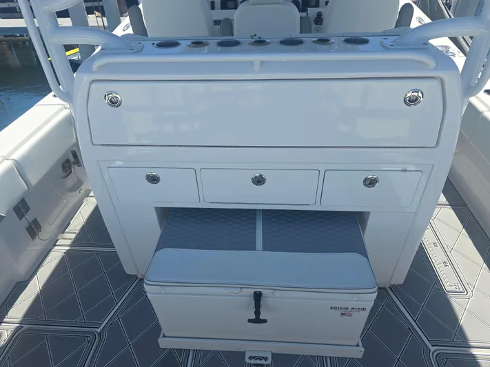  Yacht Photos Pics 2024 Invincible 43 Open Fisherman boat console with storage drawers and seating.