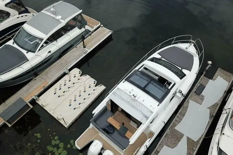  Yacht Photos Pics 2023 Sealine C335V yacht docked at marina, aerial view.