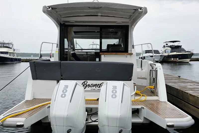  Yacht Photos Pics 2023 Sealine C335V boat docked, featuring dual 300 horsepower engines.