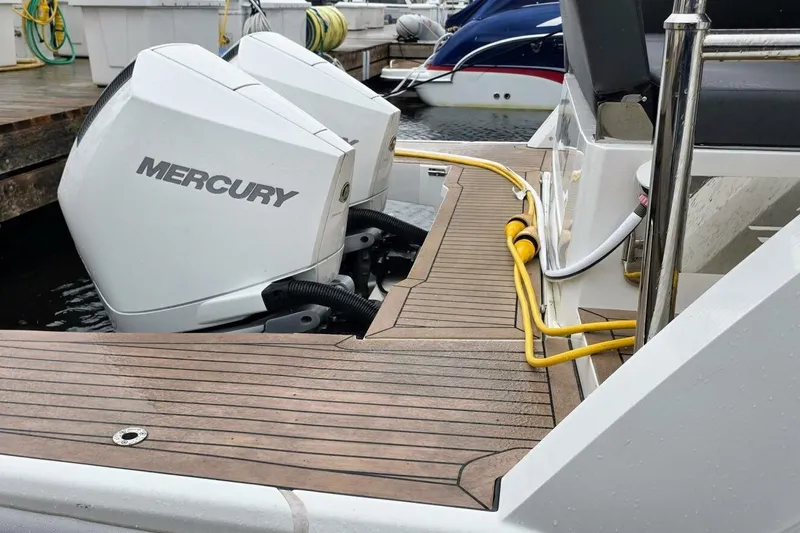  Yacht Photos Pics 2023 Sealine C335V boat with Mercury outboard engines at a dock.