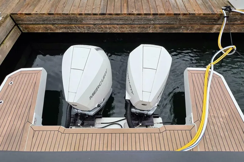  Yacht Photos Pics 2023 Sealine C335V boat with dual Mercury outboard engines at dock.