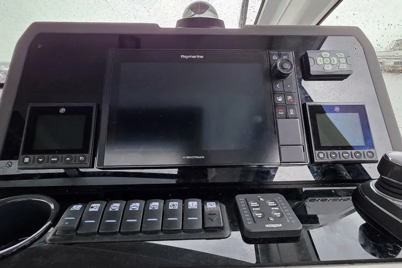  Yacht Photos Pics 2023 Sealine C335V dashboard with advanced navigation controls and touchscreen display.