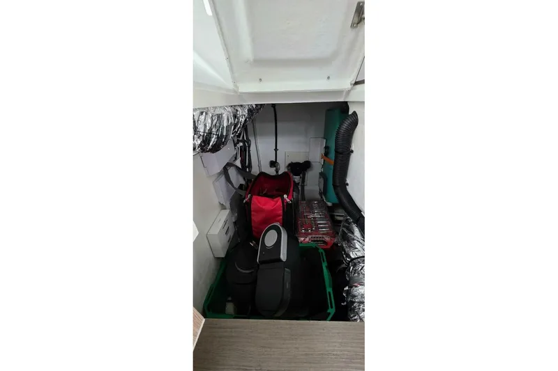  Yacht Photos Pics Storage compartment of 2023 Sealine C335V boat with equipment and tools.