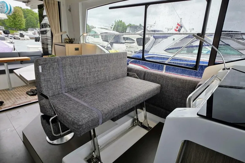  Yacht Photos Pics Interior of 2023 Sealine C335V yacht with modern seating and large windows.