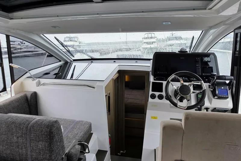  Yacht Photos Pics 2023 Sealine C335V yacht interior with modern helm and seating area.