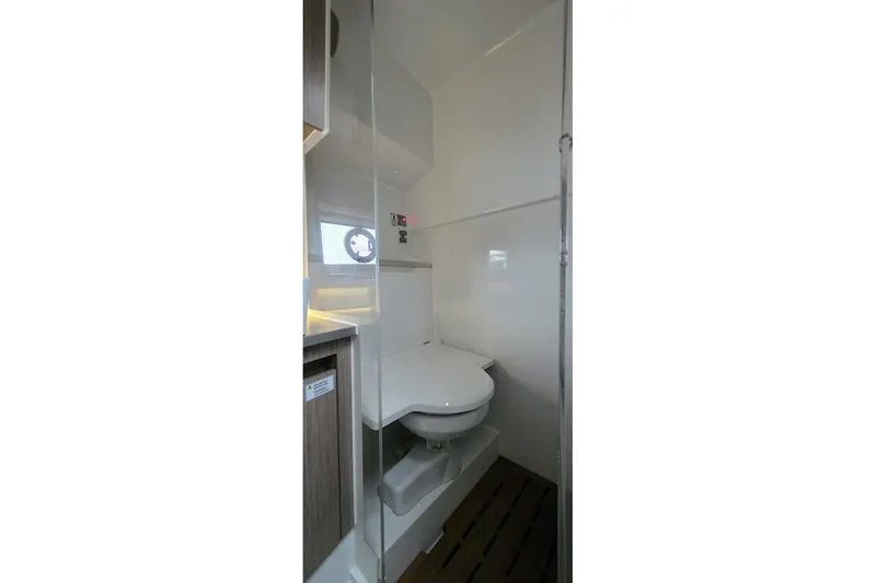  Yacht Photos Pics 2023 Sealine C335V yacht bathroom with modern fixtures and compact design.