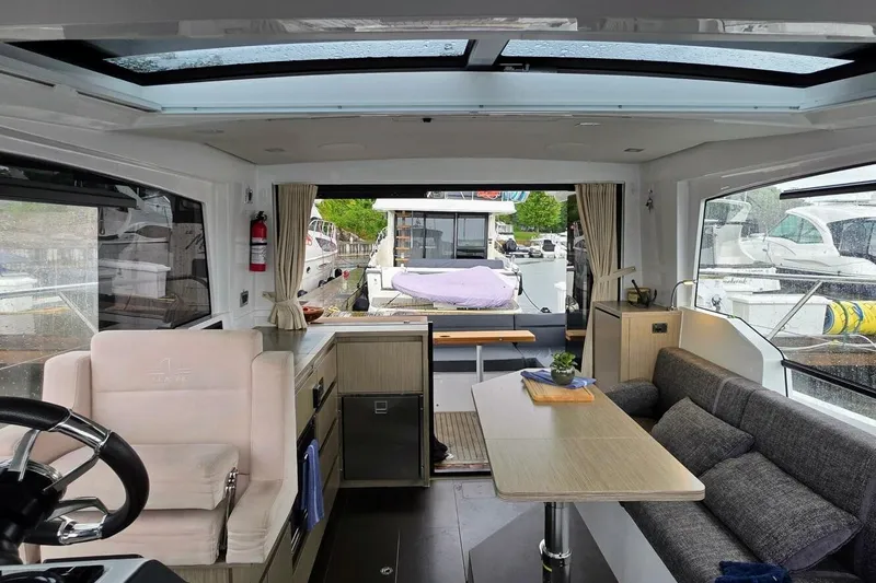  Yacht Photos Pics Interior of 2023 Sealine C335V yacht with modern seating and panoramic windows.