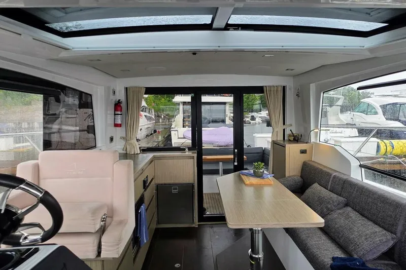  Yacht Photos Pics Interior of 2023 Sealine C335V yacht with modern seating and panoramic windows.